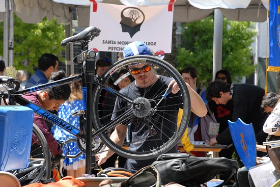 Man repairing bike at SMC
